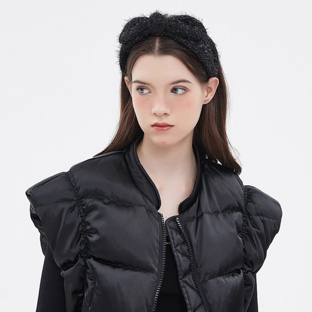 Black embellished women's headband with textured material and a twisted bow style