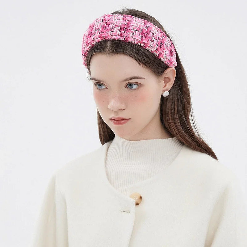 Pink tweed embellished women's headband with white and black accents, stylish textured fabric