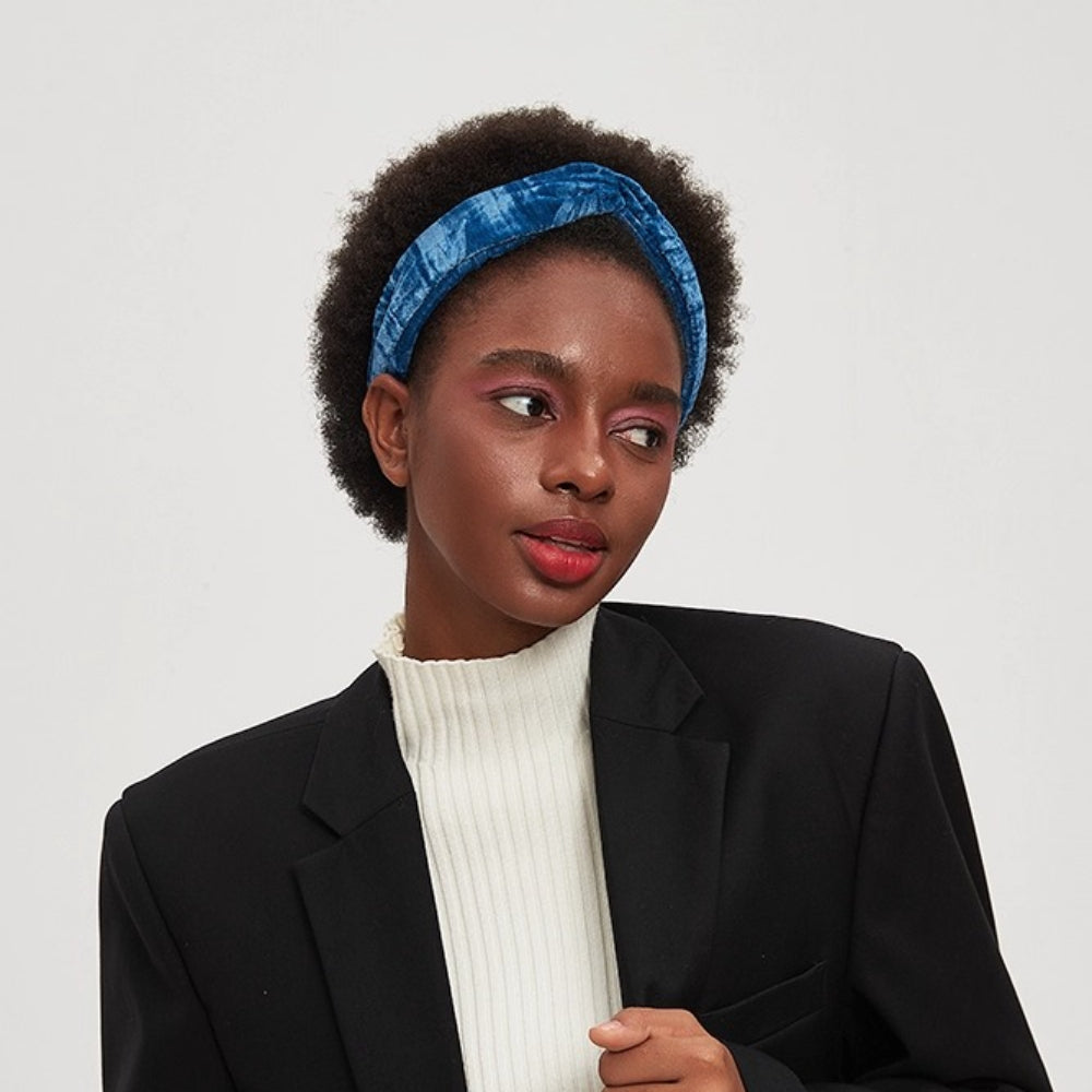 Blue velvet textured women's minimalist headband on model with afro hair