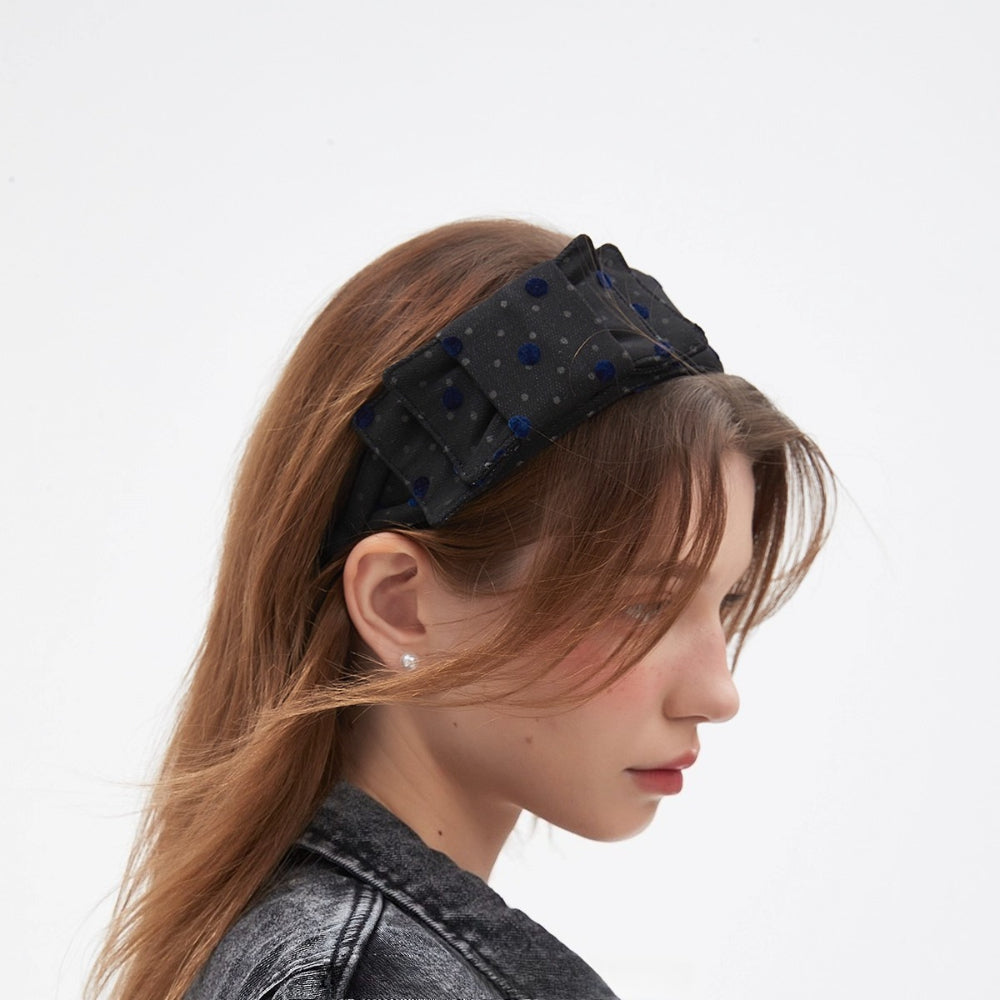 Black sheer fabric women's headband with velvet navy polka dots, embellished bow style