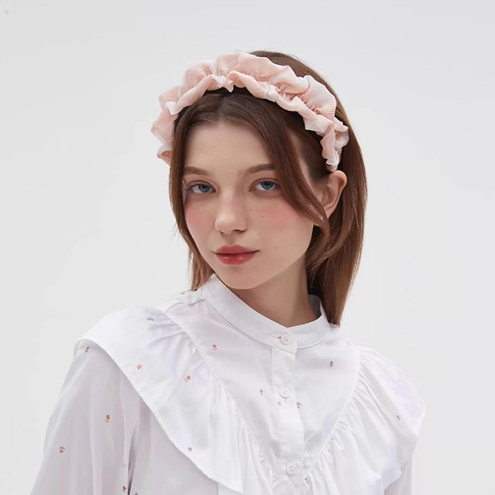 Pink ruffled fabric bow headband for women, feminine and embellished style