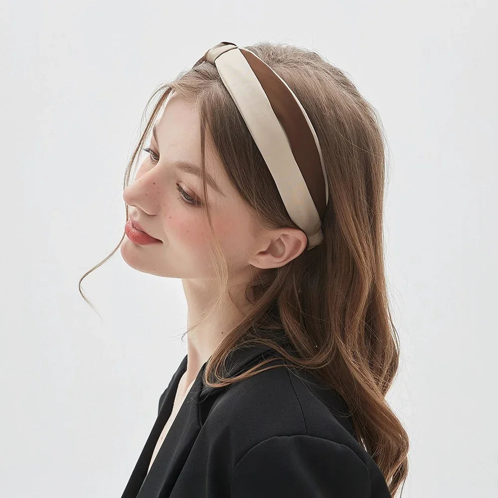 Minimalist women's headband in wide cream and brown satin stripes on model