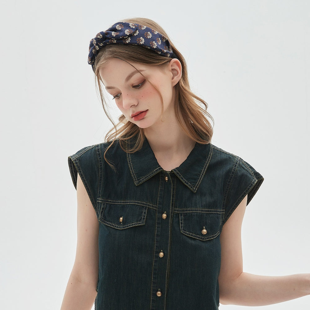 Navy blue floral printed bow headband on woman with loose hair