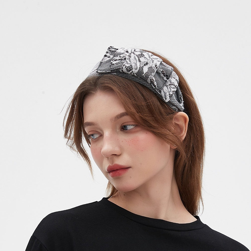 Black and white lace embellished women's headband with floral pattern