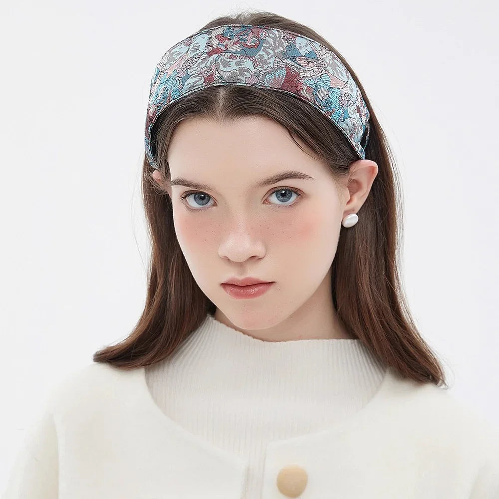 Printed fabric headband with blue, pink, and gray floral pattern, women's stylish accessory