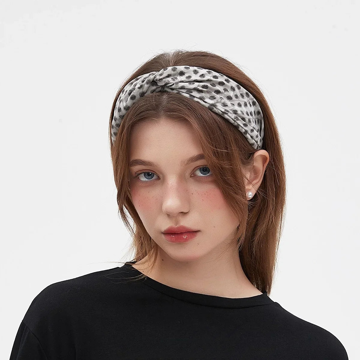women's printed bow headband in white with black spotted pattern, soft fabric