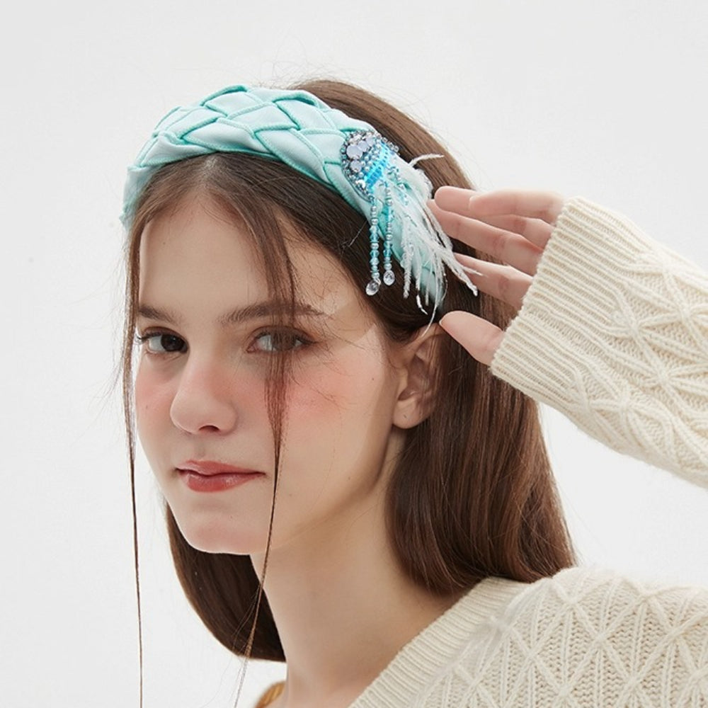Light blue quilted headband with crystal and feather embellishments, women's embellished headband