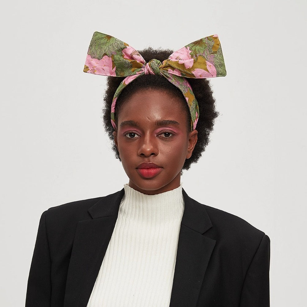 Women's floral printed headband with large bow in pink and green cotton fabric