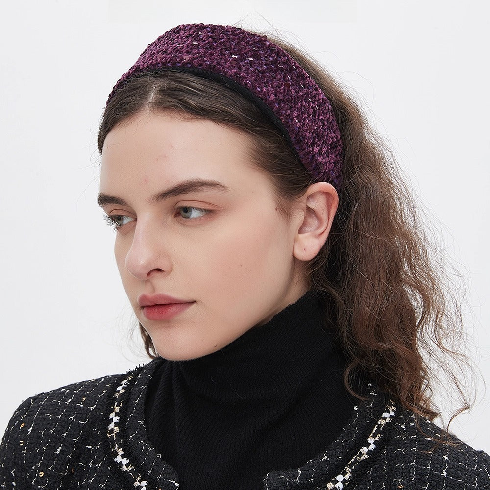 Purple textured fabric women's minimalist headband on model with curly hair