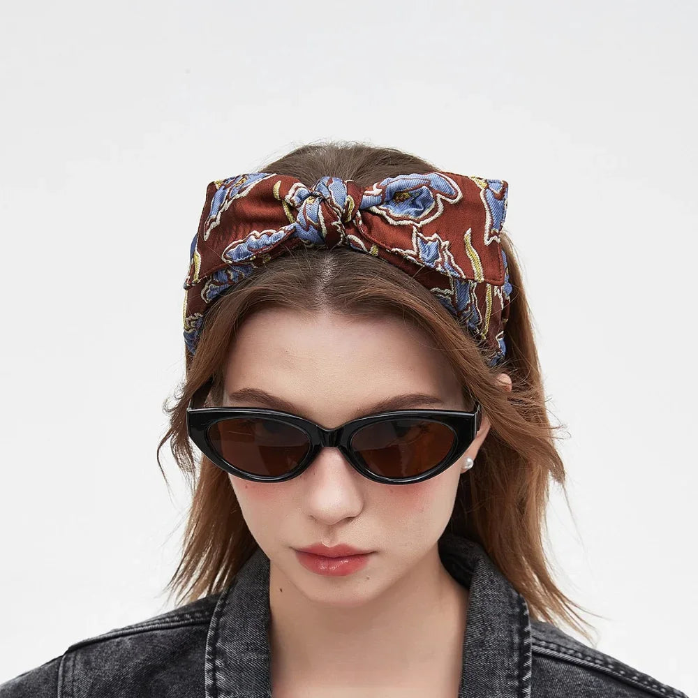 Brown fabric bow headband with blue floral print, women's printed bow headband