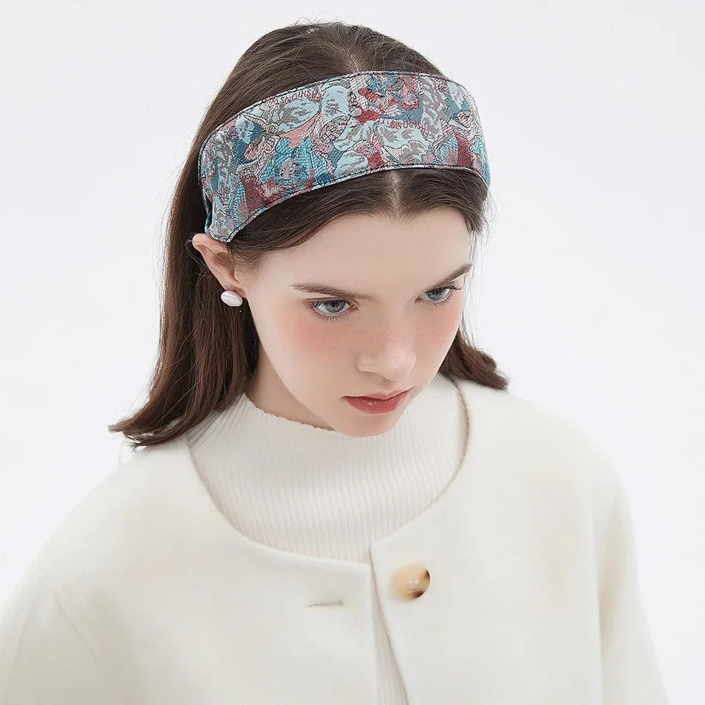 Printed floral fabric women's headband in blue and red tones, wide style