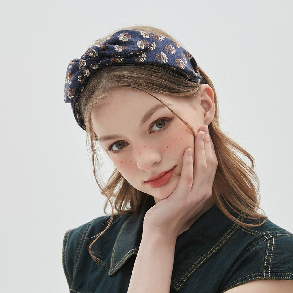 Navy blue floral printed women's headband with bow detail, fabric material