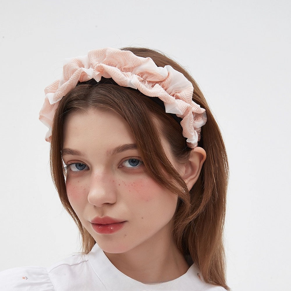 Pink ruffled fabric headband with a soft textured pattern, women's embellished style