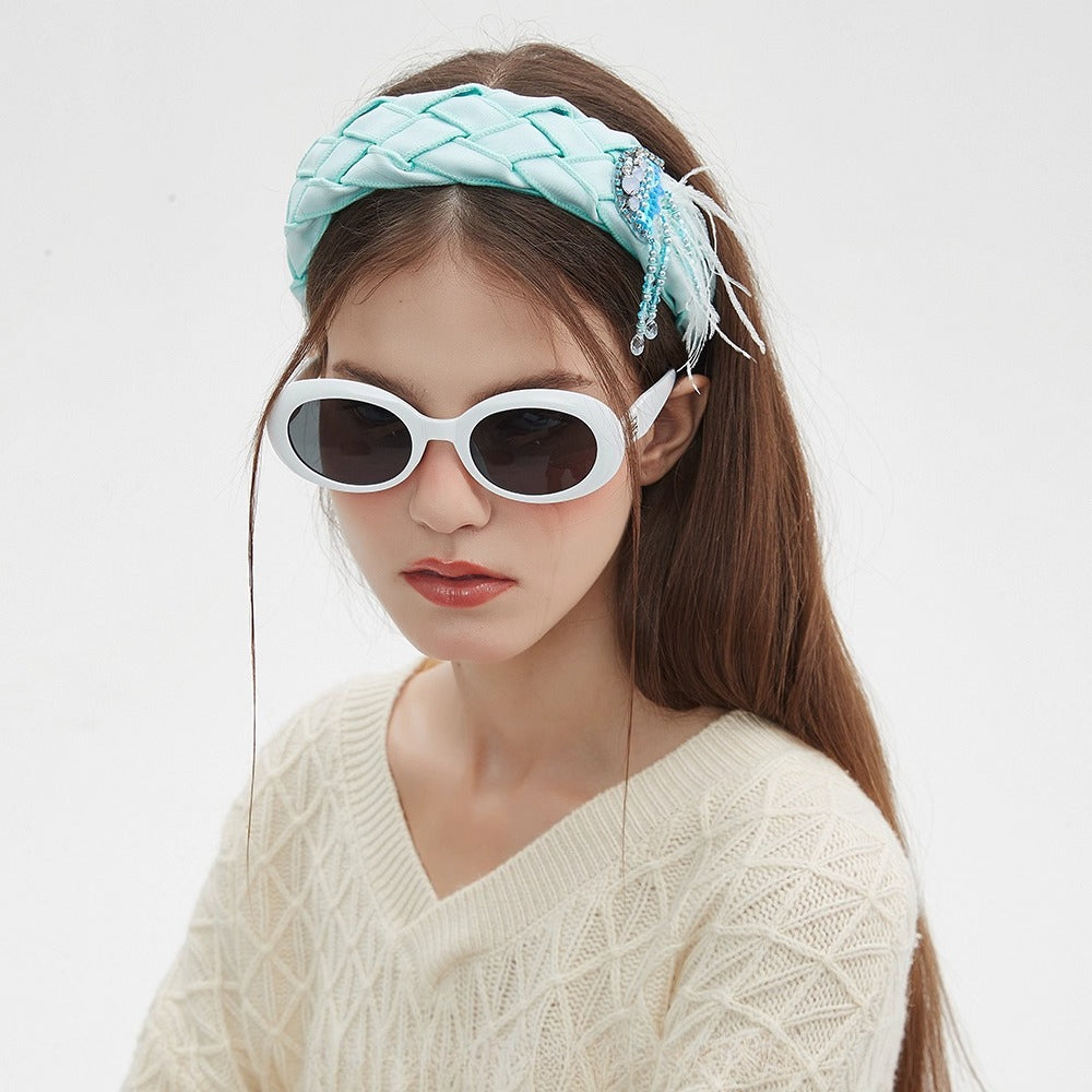 Light blue padded woven headband with feather and bead embellishments, women's embellished headband