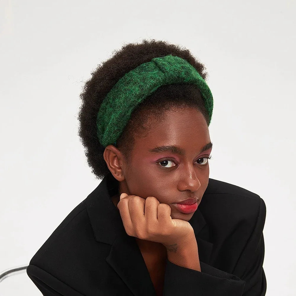 Green fuzzy textured women's minimalist headband on model with afro hair