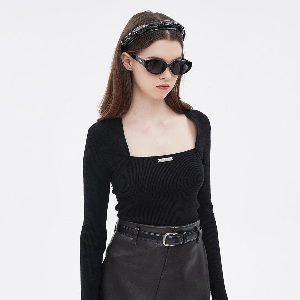 Black embellished women's headband with small decorative pearls and twisted design