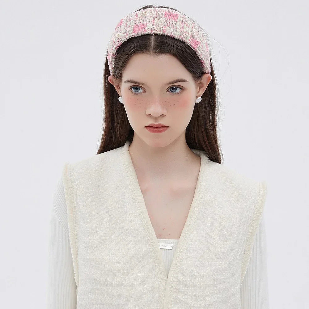 Pink and cream textured fabric bow headband in minimalist style for women