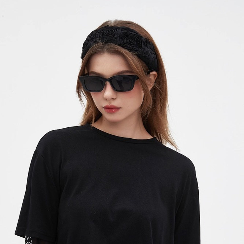 black embellished women's headband with 3D floral rosette design