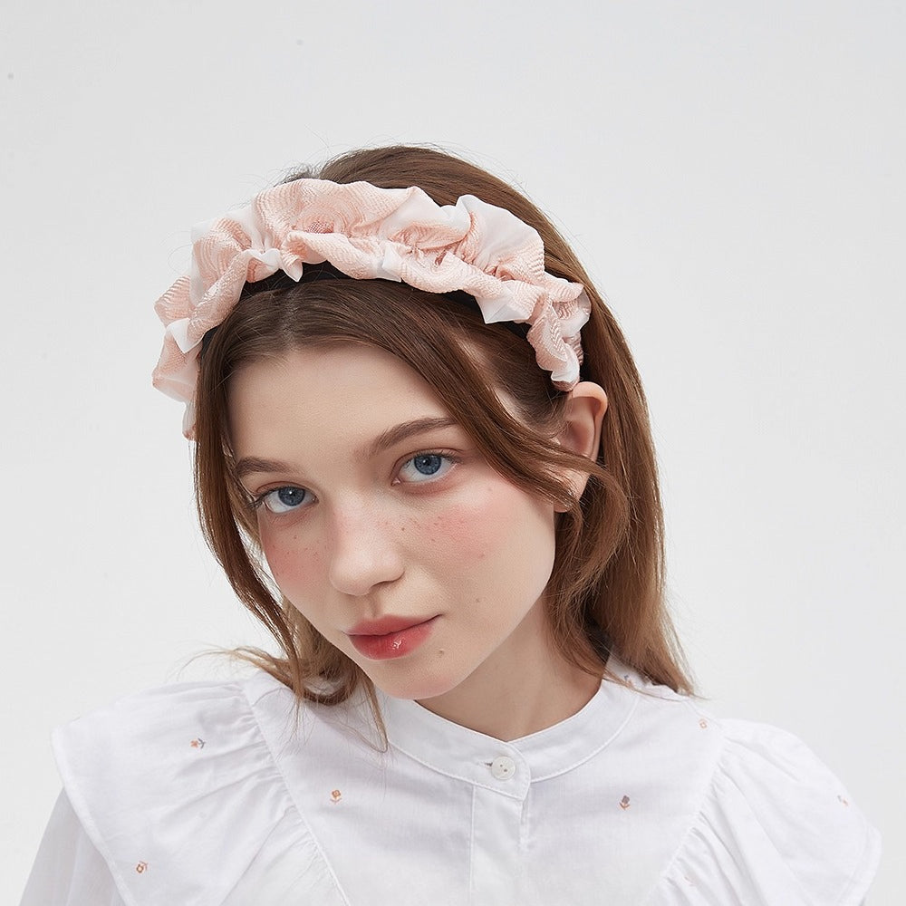 Pink ruffled fabric headband with a soft textured pattern, women's embellished style