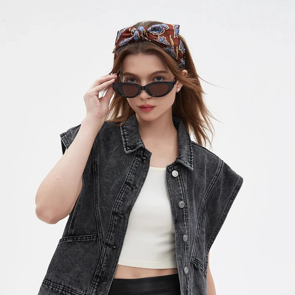 Brown floral printed bow headband on woman with casual denim vest