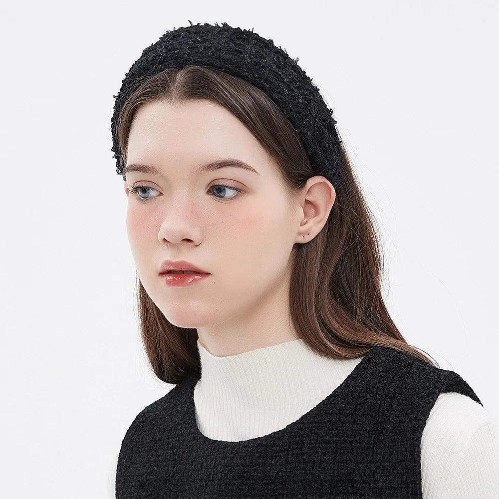 women's black embellished textured fabric headband with a soft, chunky style