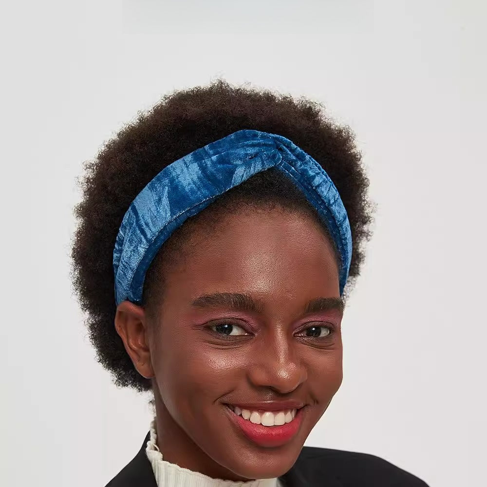 Blue velvet bow headband for women with a twisted front detail, stylish and embellished