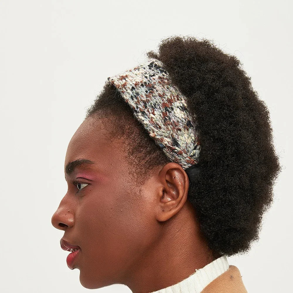Knitted printed women's headband in brown, cream, and black tones, cozy textured style