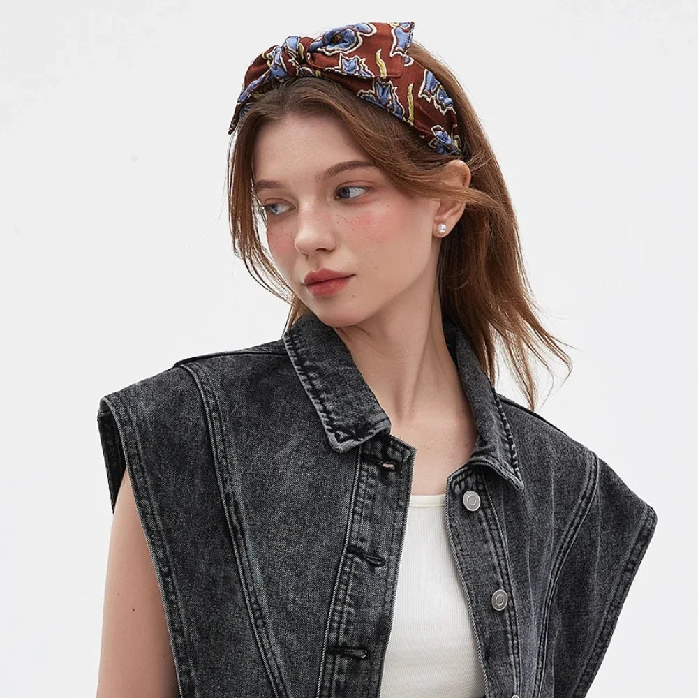 Brown printed bow headband with blue floral pattern, women’s stylish fabric accessory