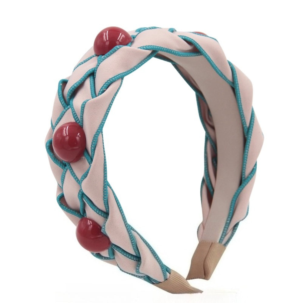 Pink fabric braided women's headband with turquoise piping and red bead embellishments