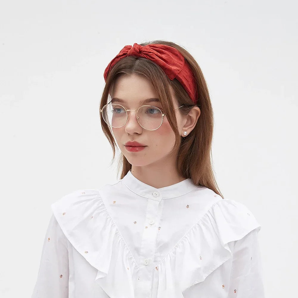 Red fabric bow headband in minimalist style for women