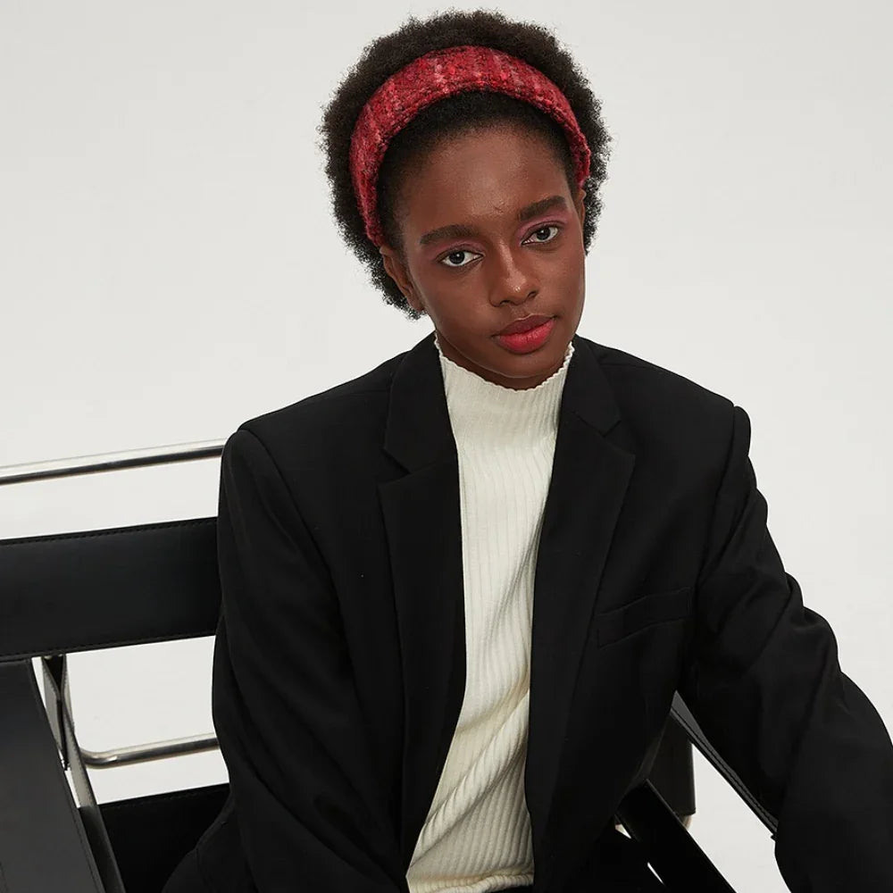 Red textured fabric women's minimalist headband on model with natural hair